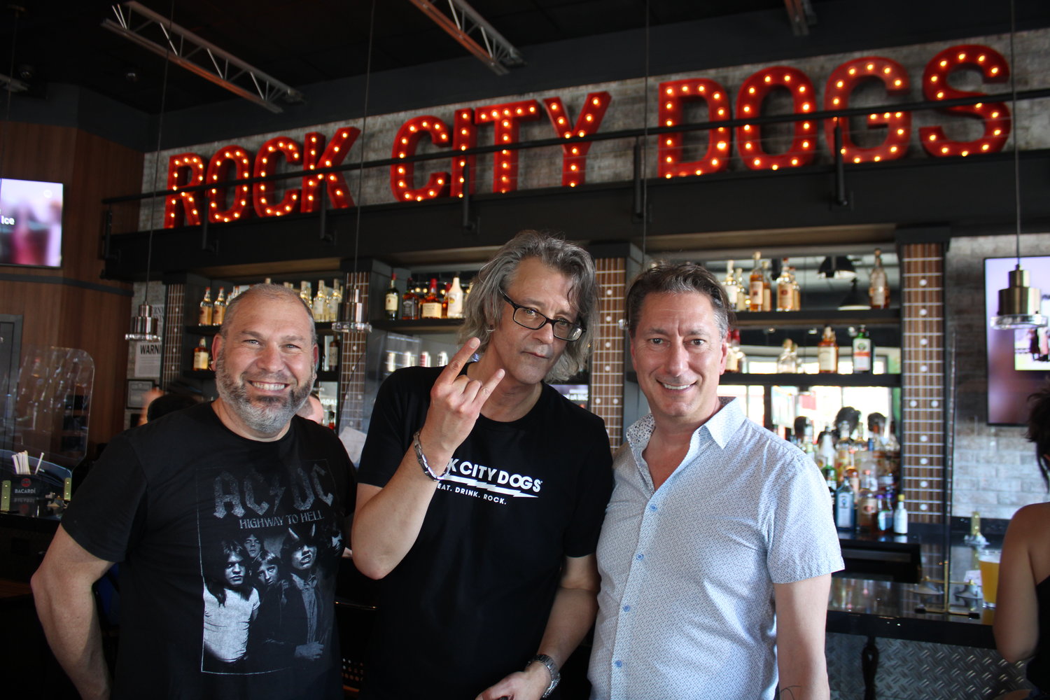 Rock City Dogs, a new music-themed eatery located at 3 E. Main Street in Bay Shore, is a joint venture of Tom McGiveron, Stevie Reno, Stephen Bennett and Vina Vollmer (not pictured). Read the restaurant review on page 9.
